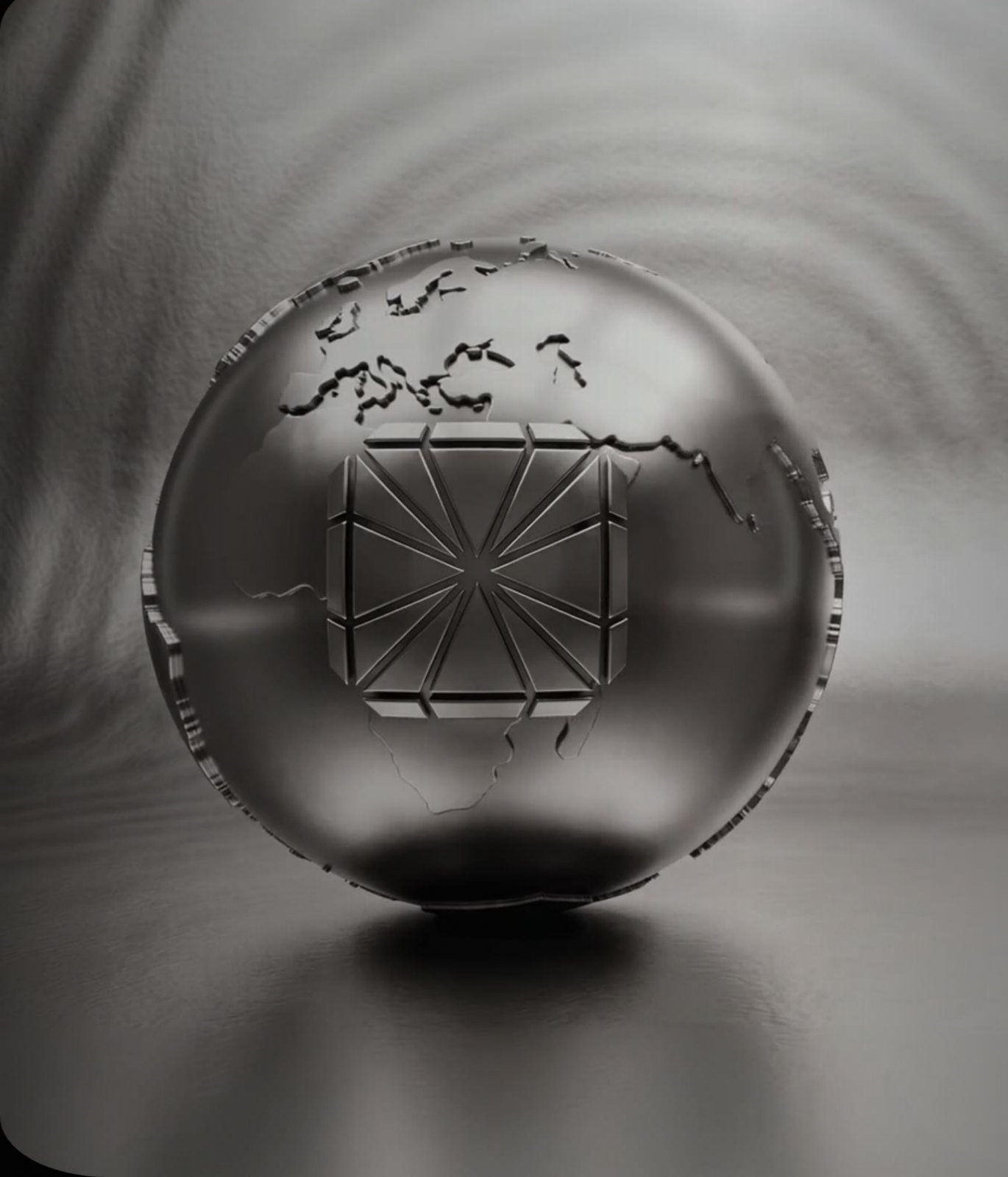 Metallischer Globus mit eingraviertem STIG-Symbol